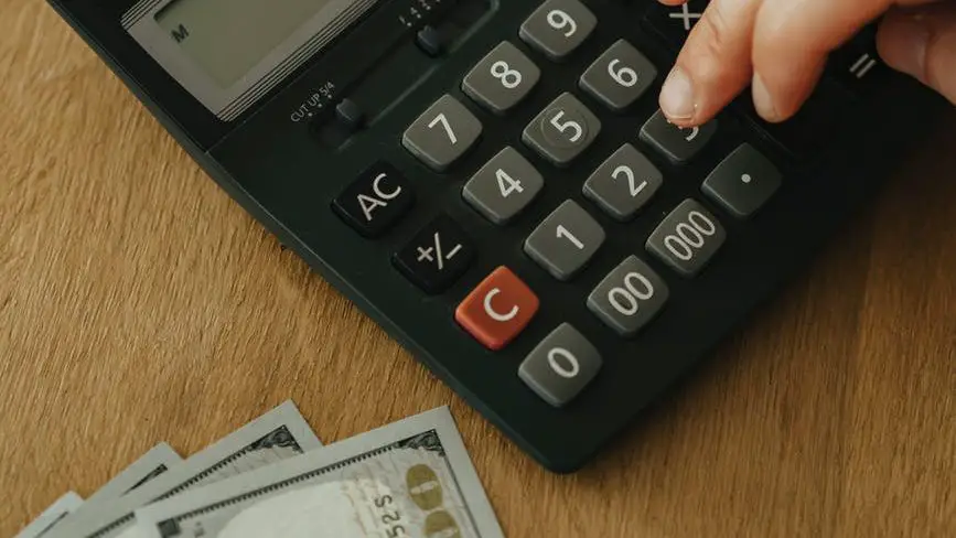 person using a black calculator