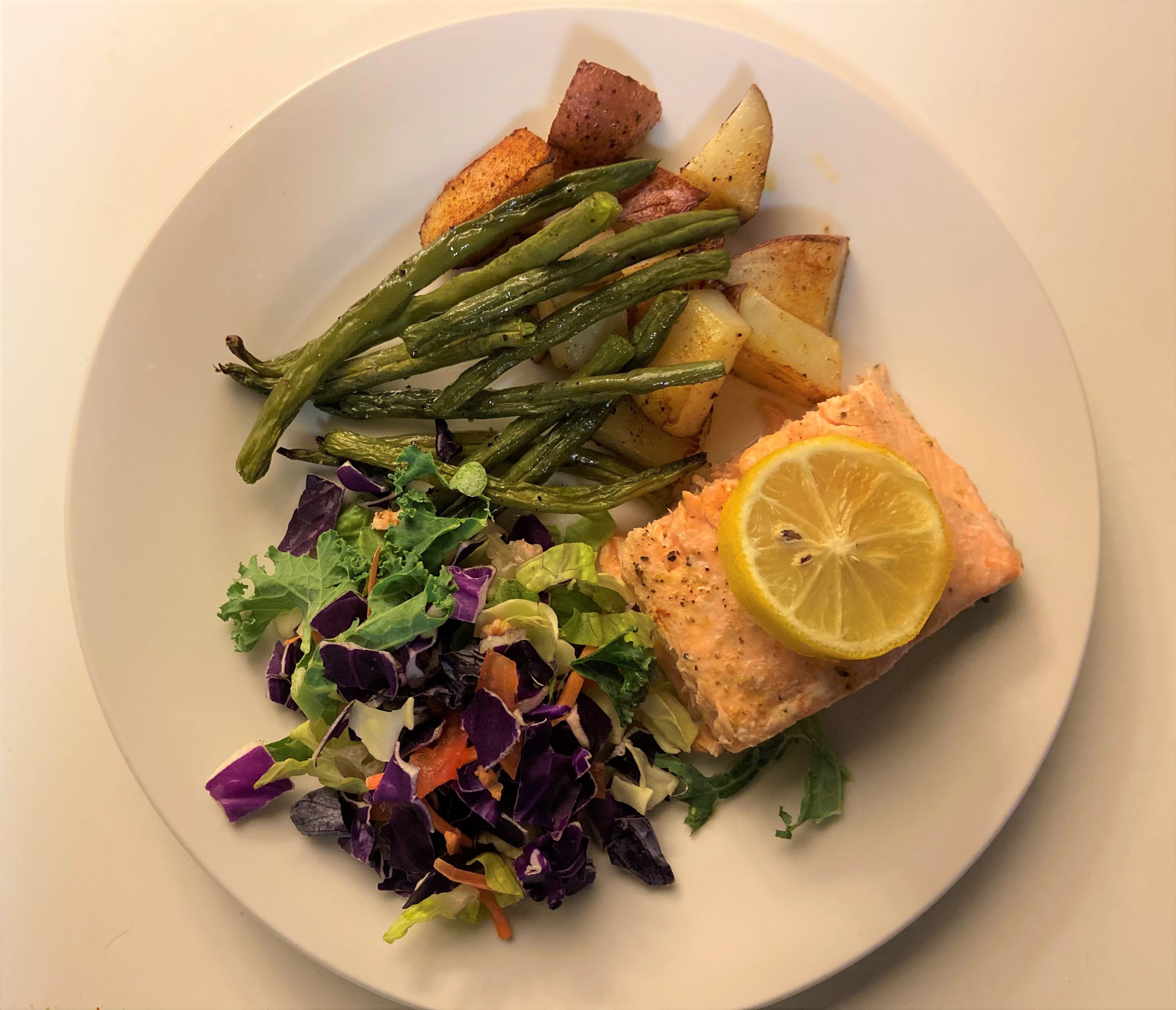 Lemon roasted salmon with green beans and roasted potatoes.