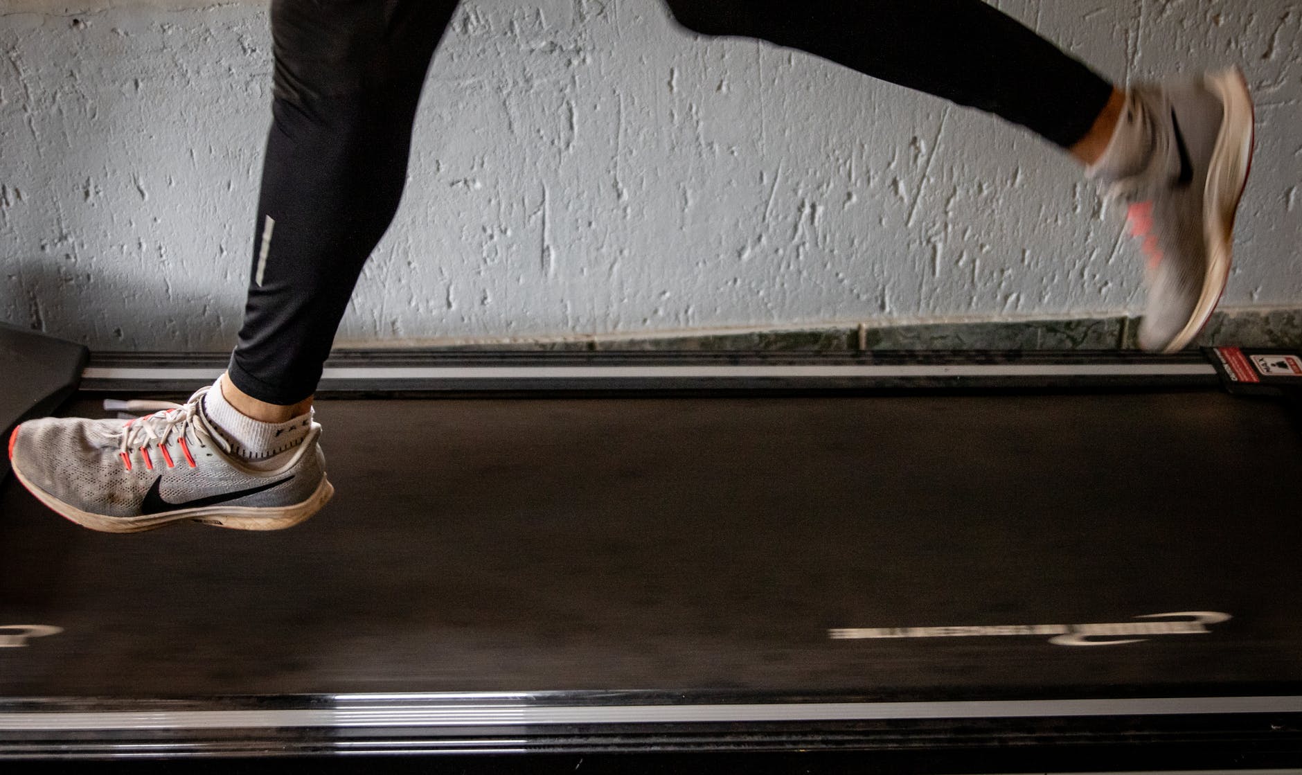 person in black pants and brown shoes