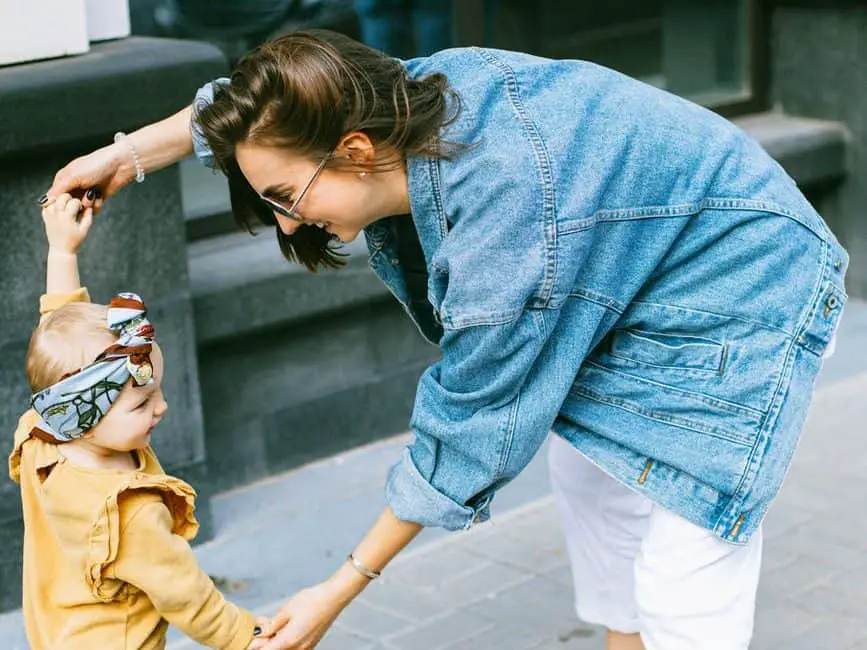 Mom dancing and laughing with child