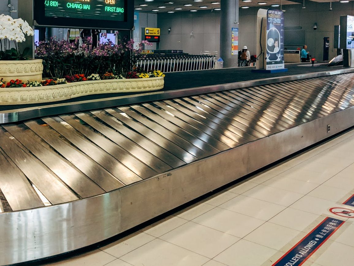 a luggage conveyor inside airport