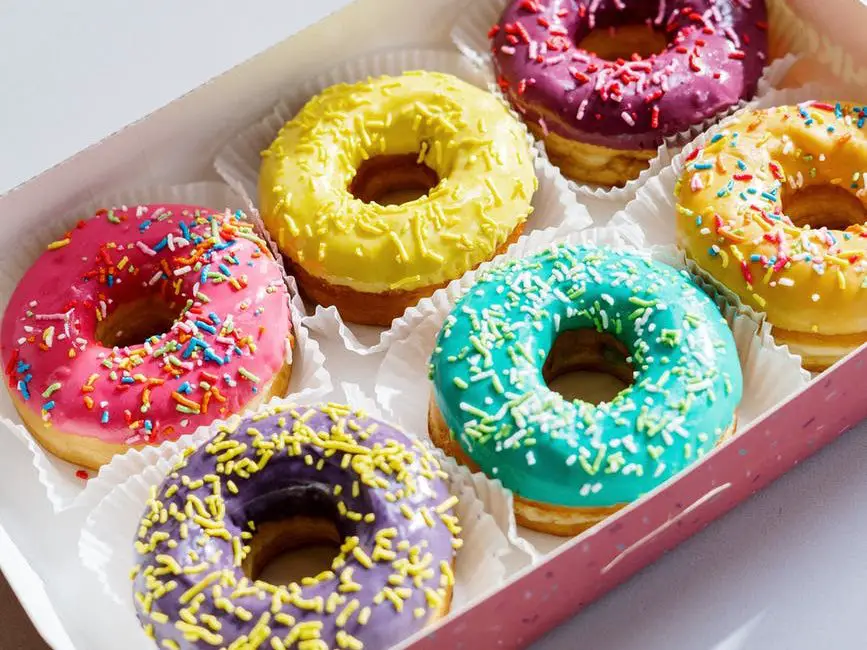 white and pink doughnut on white box