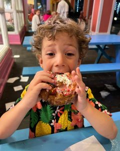 Boy eating doughnut