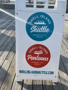 Shell Island Shuttle and Shell Island Pontoons Sign