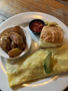 Omelet, biscuit, and friend apples at Crockett's Breakfast Camp