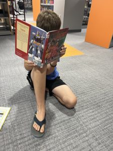 Child reading book about Japan