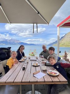 Family enjoying afternoon tea on Lake Wakatipu