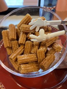 Churros with Mickey Mouse hand tongs