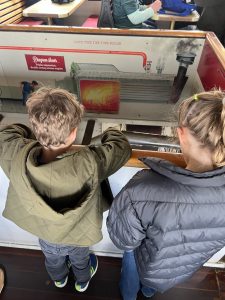 Children observing the engine room on TSS Earnslaw