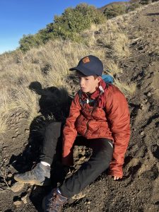 child resting during hike